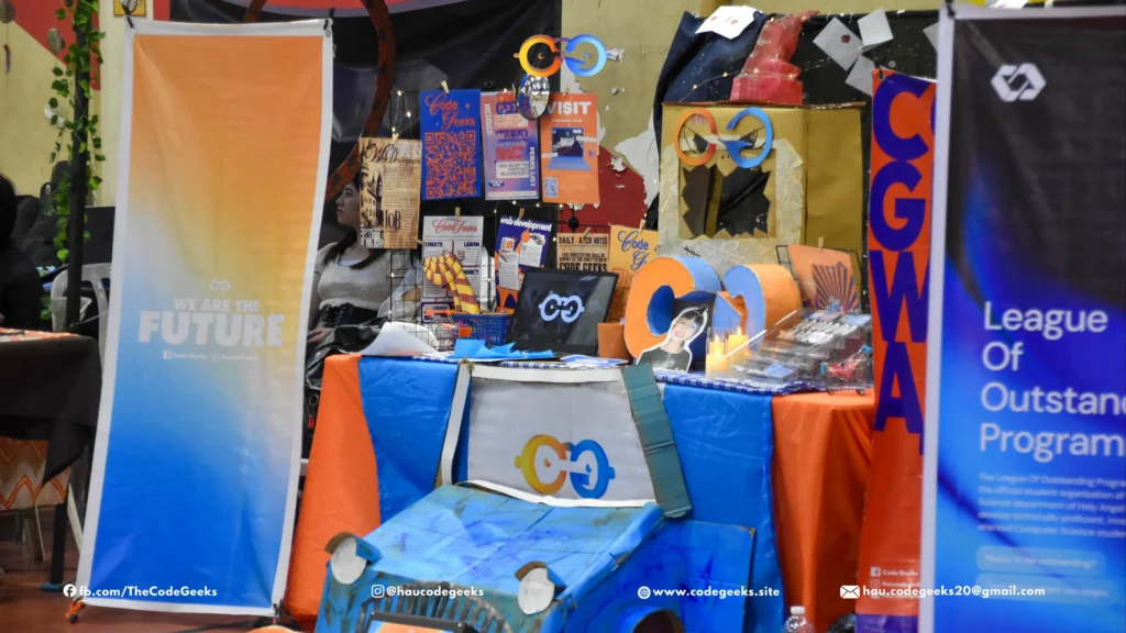 Code Geeks Spellbound 2026 booth setup with orange and blue banner