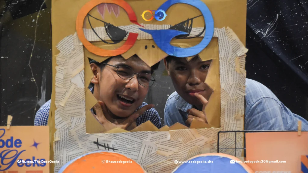 Freshmen posing at Code Geeks photo booth during Spellbound 2026